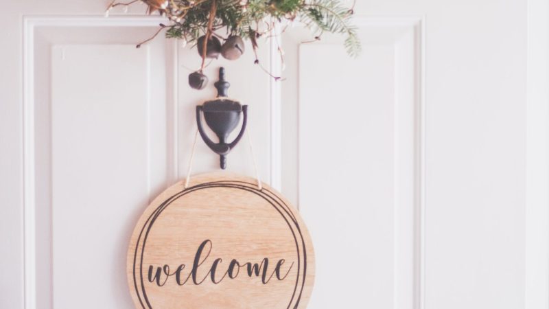 brown wooden welcome wall decor